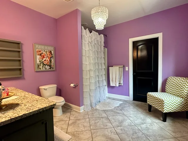 a view of entryway with wooden floor and windows