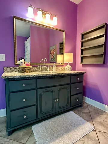 a bedroom with a bed wooden floor and window