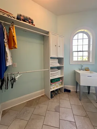 a room with gym equipment and a rug