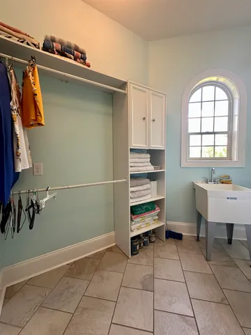 a room with gym equipment and a rug