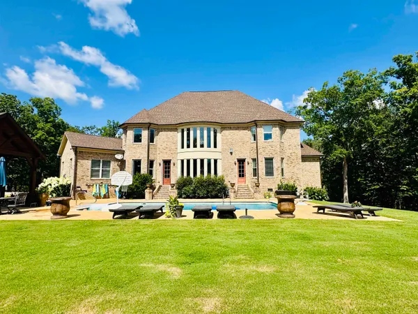 a view of a house with swimming pool
