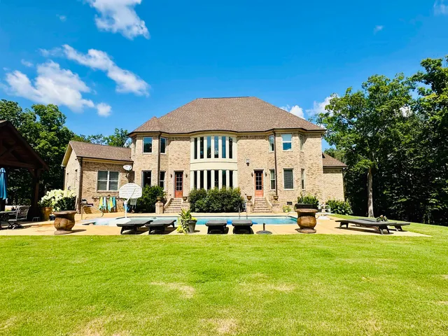 a view of a house with swimming pool