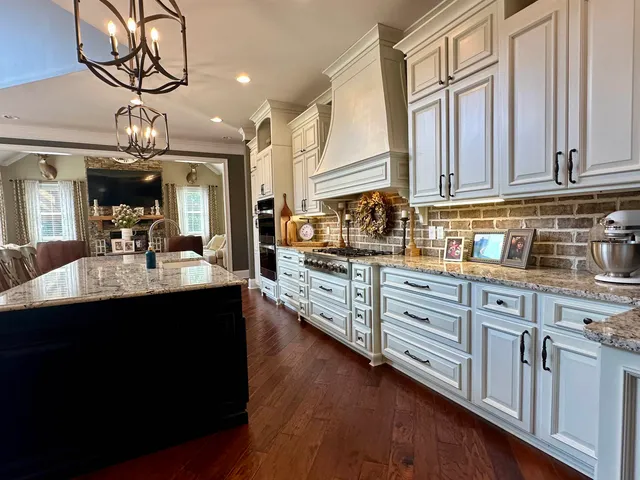 a view of a house with a swimming pool and sitting area