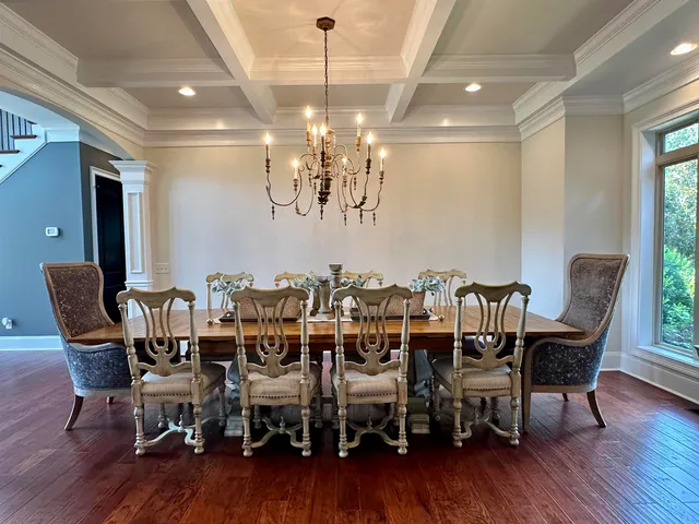 a kitchen with lots of counter space and painting on the wall
