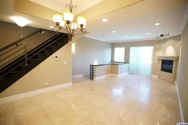 a view of a kitchen with a sink and a stove top oven