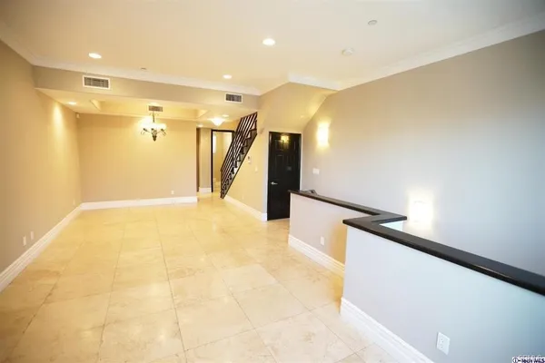 a view of a hallway with stairs