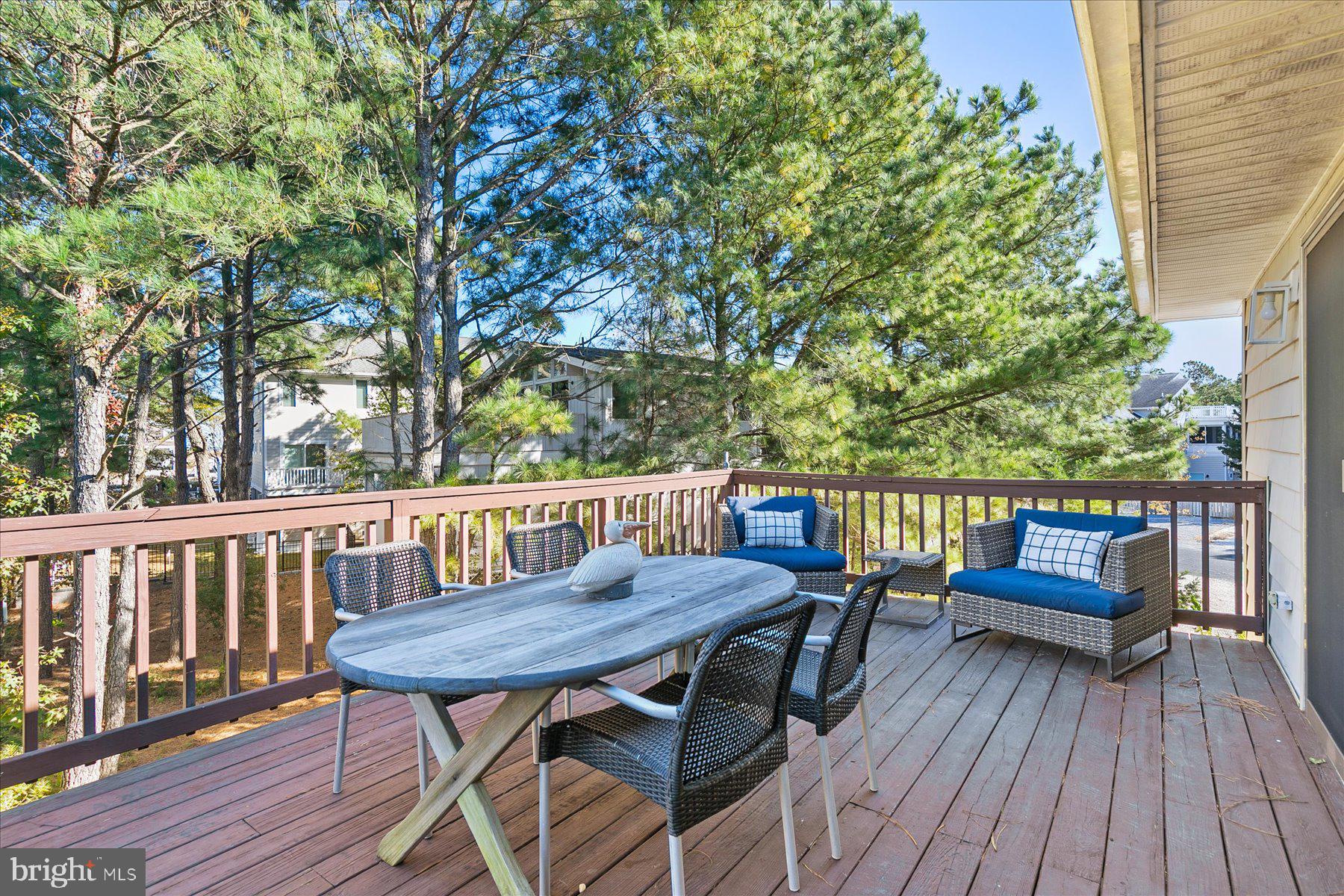 39692 Kittiwake Road Bethany Beach, DE 19930 - Photo 17 of 32 a view of a deck patio and outdoor seating