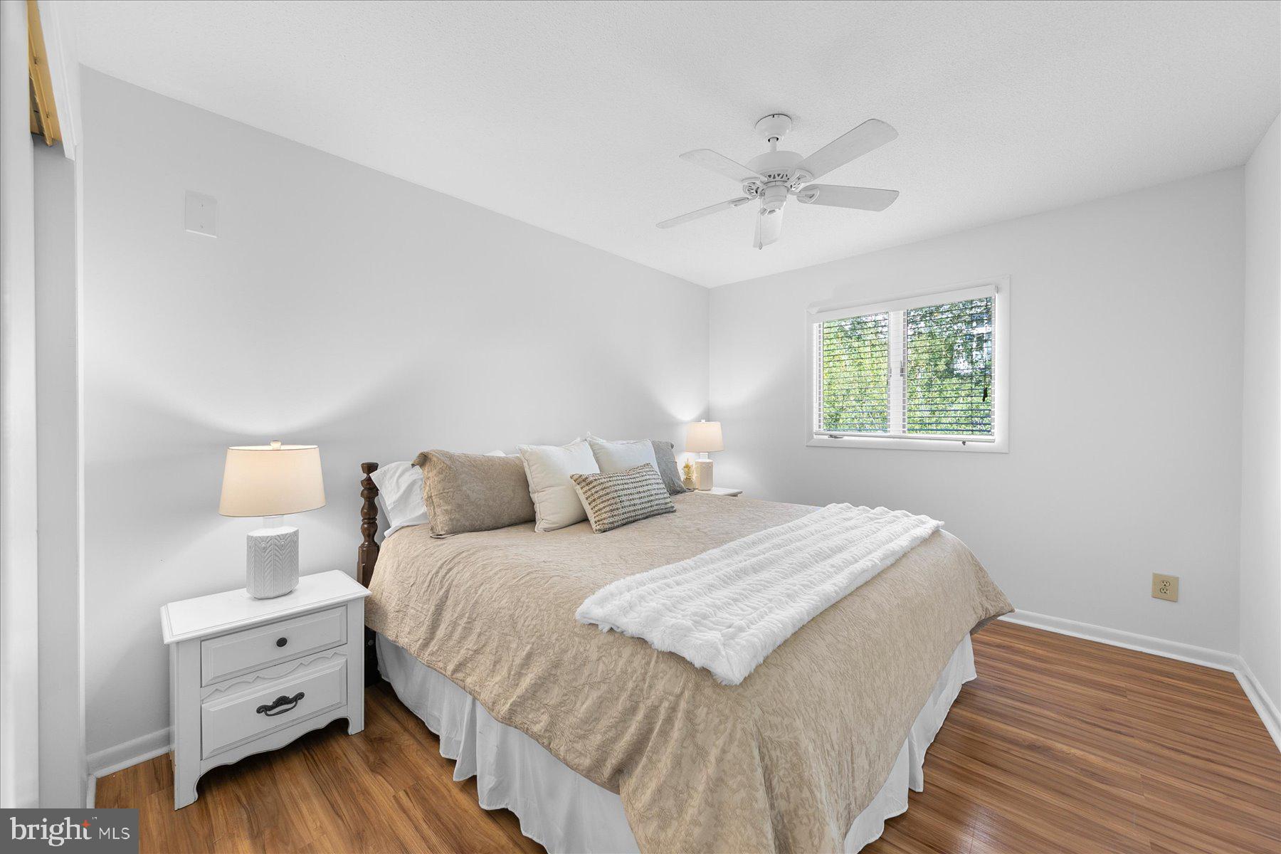 39692 Kittiwake Road Bethany Beach, DE 19930 - Photo 21 of 32 a bedroom with a bed and a window