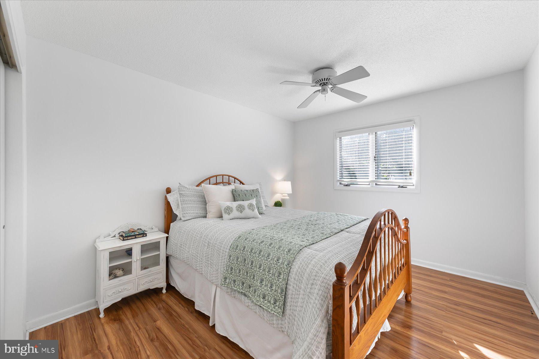 39692 Kittiwake Road Bethany Beach, DE 19930 - Photo 27 of 32 a bedroom with bed and a window