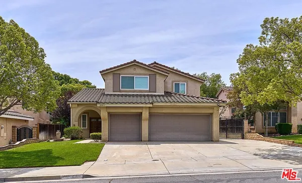 a front view of a house with yard