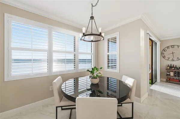 a bedroom with a bed window and a flat screen tv