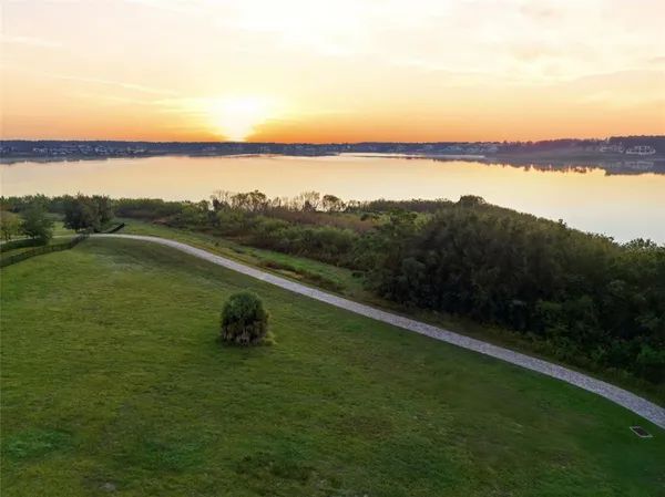 a front view of a house with outdoor seating