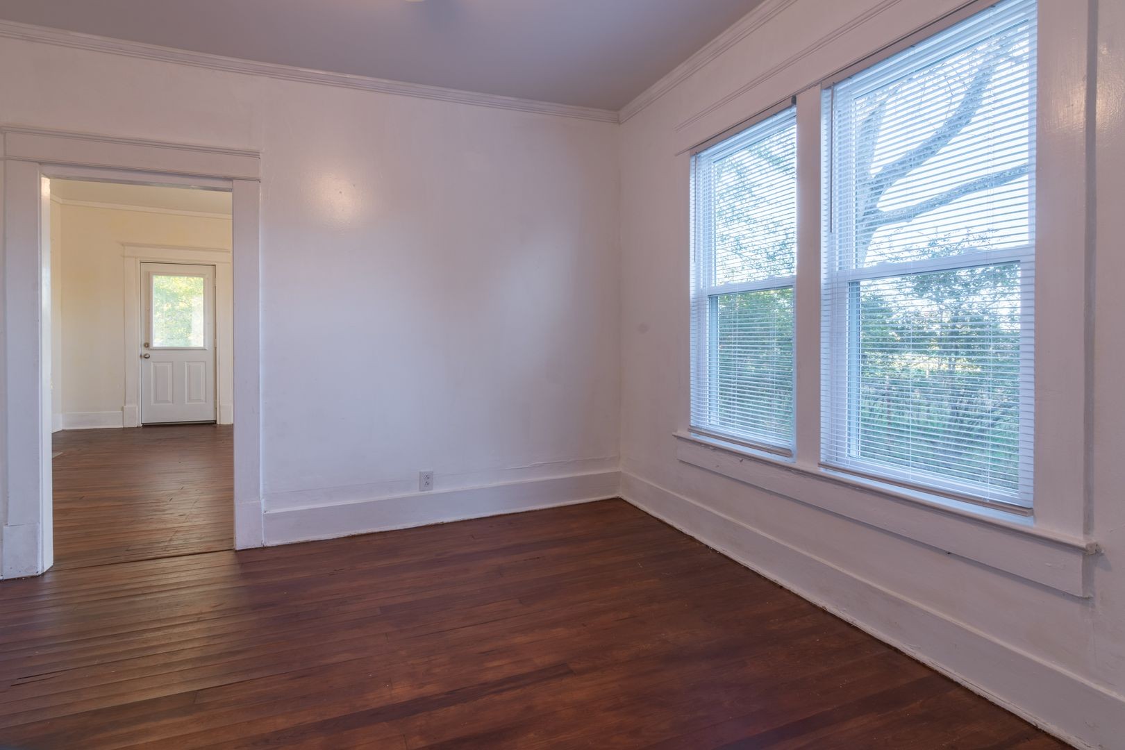 1809 Cairo Bend Road Lebanon, TN 37087 - Photo 11 of 17 a view of an empty room with wooden floor and a window