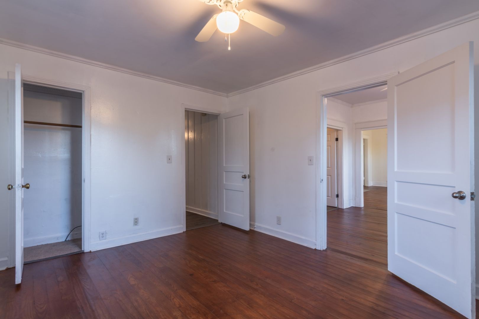 1809 Cairo Bend Road Lebanon, TN 37087 - Photo 12 of 17 a view of an empty room with wooden floor and a ceiling fan