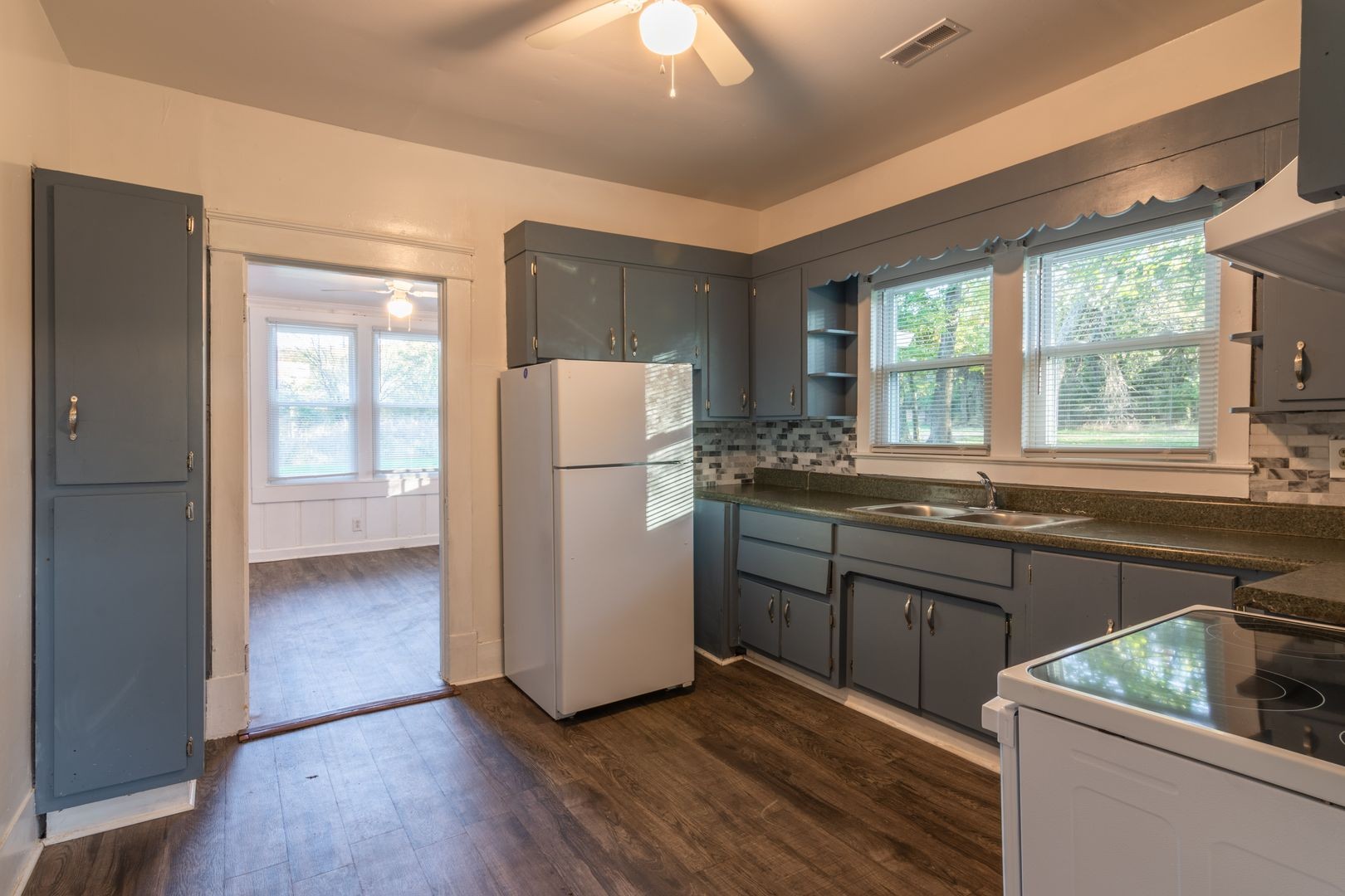 1809 Cairo Bend Road Lebanon, TN 37087 - Photo 5 of 17 a kitchen with sink a refrigerator and wooden cabinets