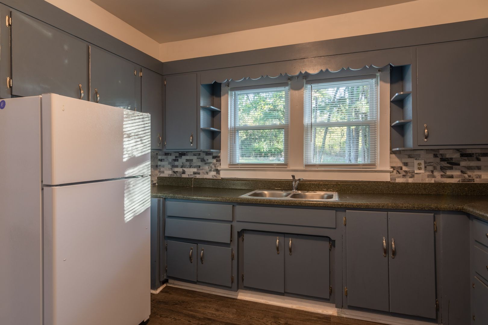1809 Cairo Bend Road Lebanon, TN 37087 - Photo 6 of 17 a white refrigerator freezer sitting inside of a kitchen with stainless steel appliances granite countertop cabinets and a refrigerator