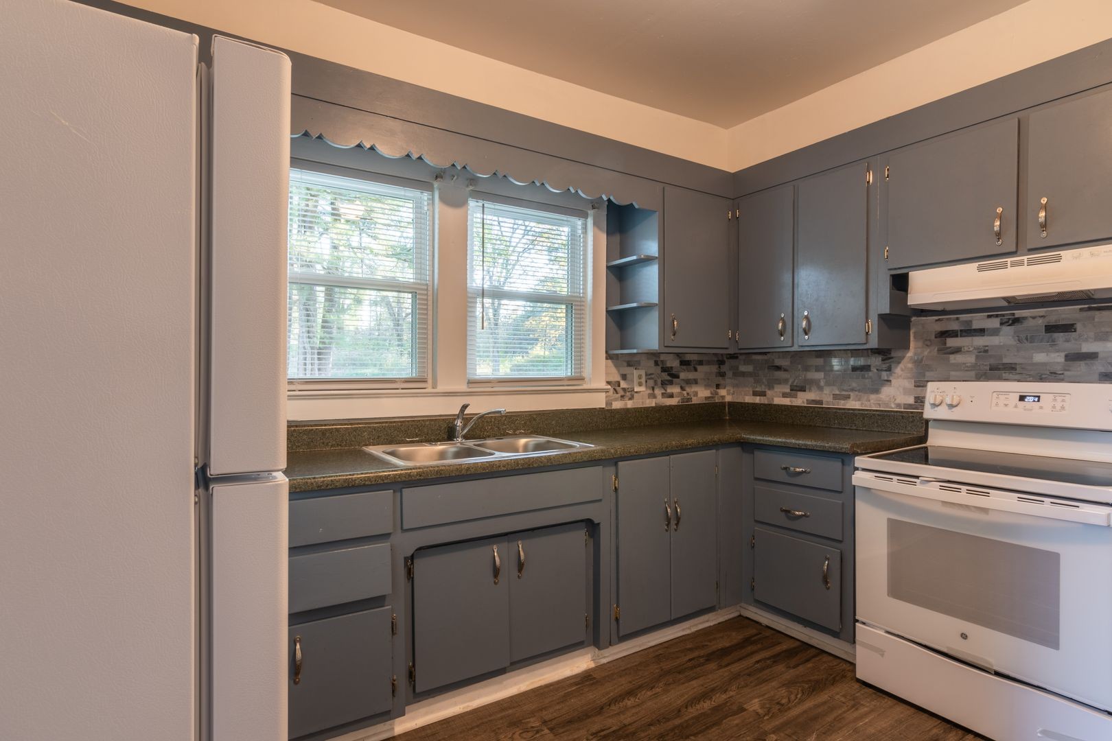 1809 Cairo Bend Road Lebanon, TN 37087 - Photo 7 of 17 a kitchen with a sink stove and cabinets