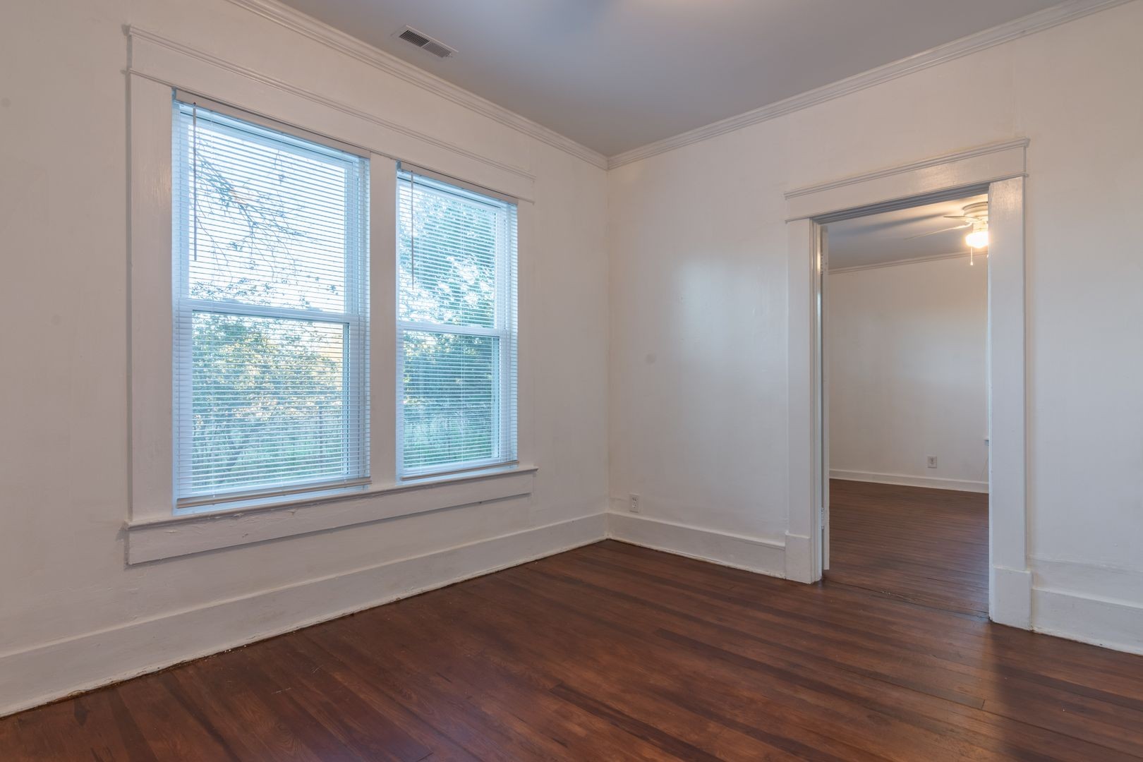 1809 Cairo Bend Road Lebanon, TN 37087 - Photo 9 of 17 a view of an empty room with wooden floor and a window