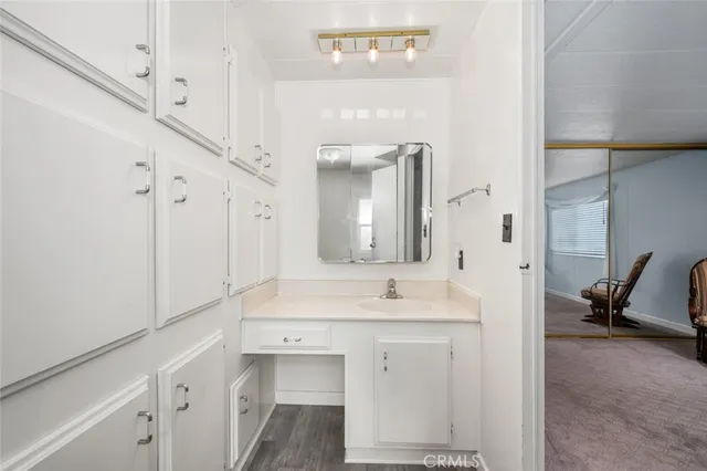 a en suite bathroom with a sink and a mirror
