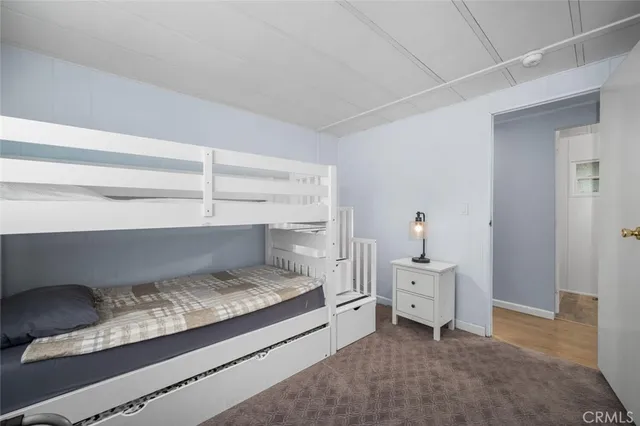 a bedroom with a bed and a cabinets