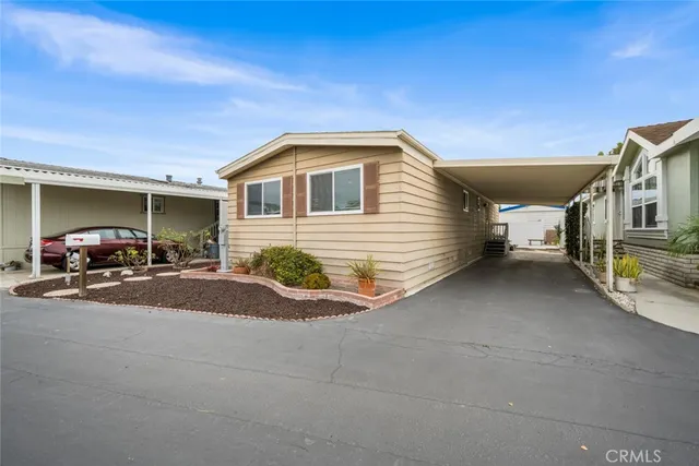 a view of hotel and car parked in front of house