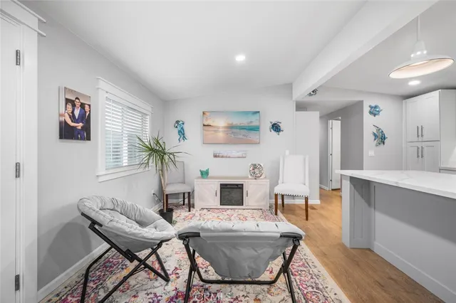 a living room with furniture a fireplace and a table
