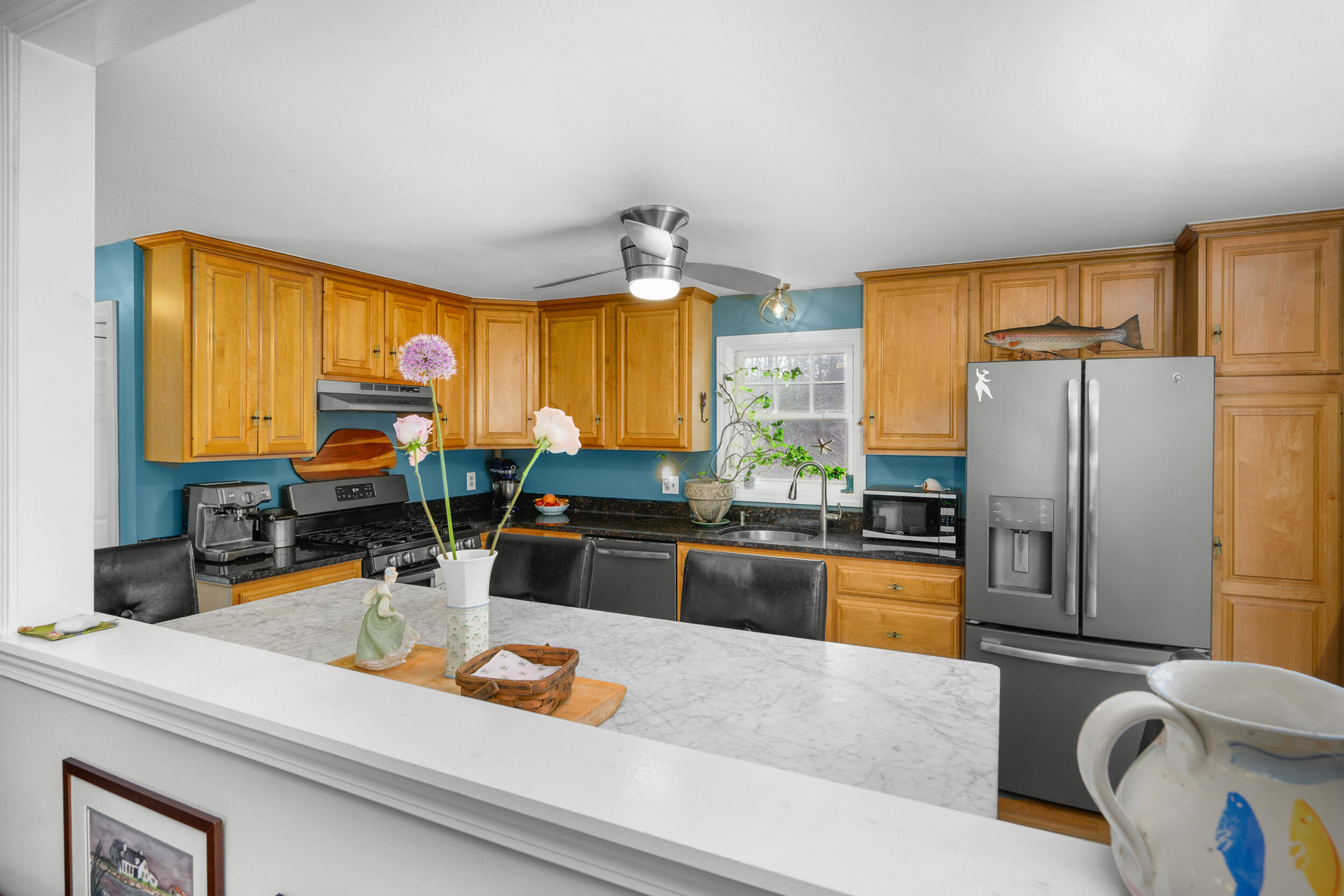 43 Chickadee Lane Centerville, MA 02632 - Photo 11 of 48 a kitchen with stainless steel appliances granite countertop a sink a stove and refrigerator