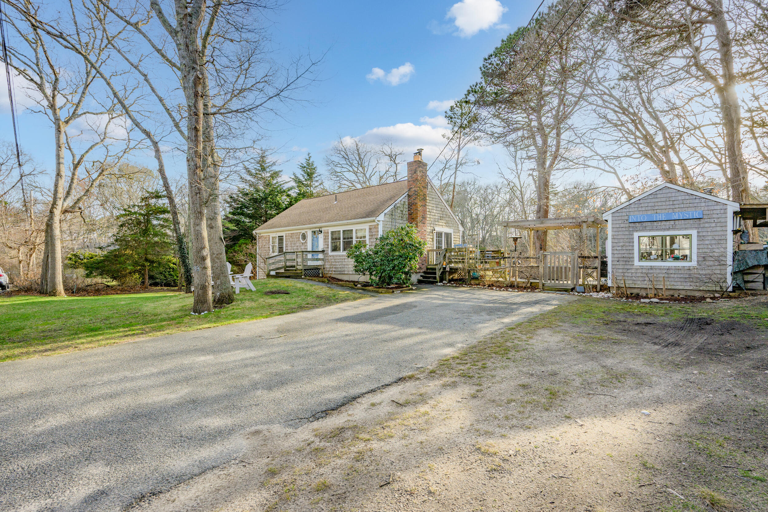 43 Chickadee Lane Centerville, MA 02632 - Photo 3 of 48 a view of a large house with a street