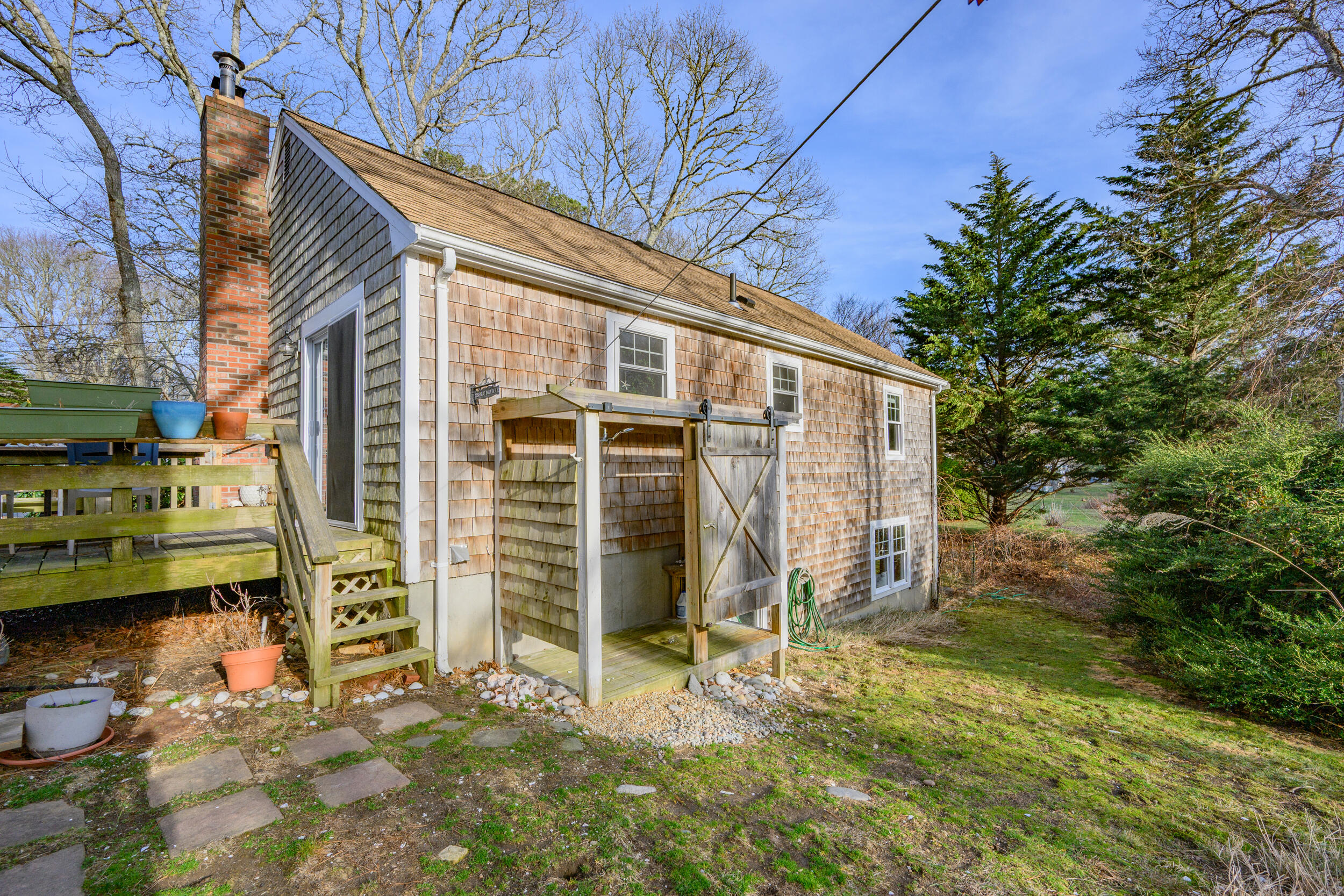 43 Chickadee Lane Centerville, MA 02632 - Photo 31 of 48 a view of a house with a yard
