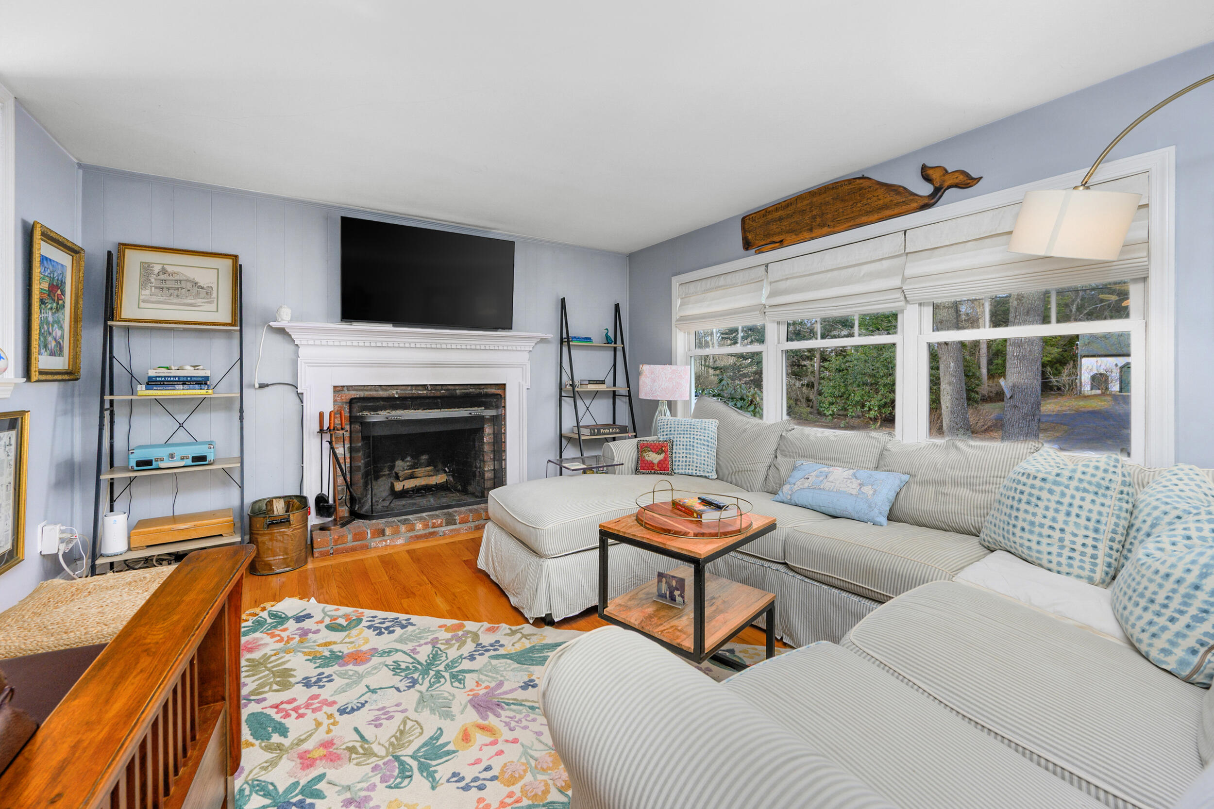 43 Chickadee Lane Centerville, MA 02632 - Photo 10 of 48 a living room with furniture a rug and a fireplace