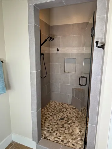 a bathroom with a bathtub and a window