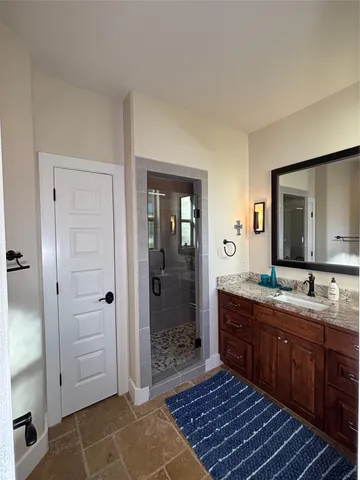 a bathroom with a shower and a bathtub