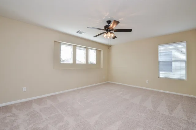 a view of empty room with windows