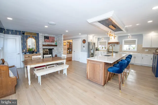 a kitchen with wooden cabinets and stainless steel appliances