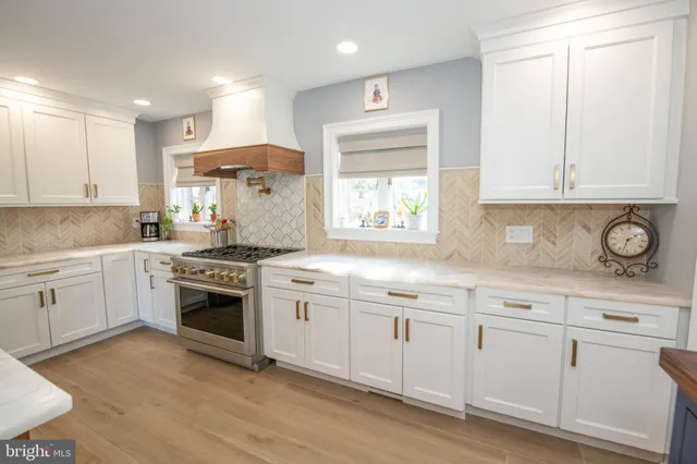 a view of an entryway with wooden floor