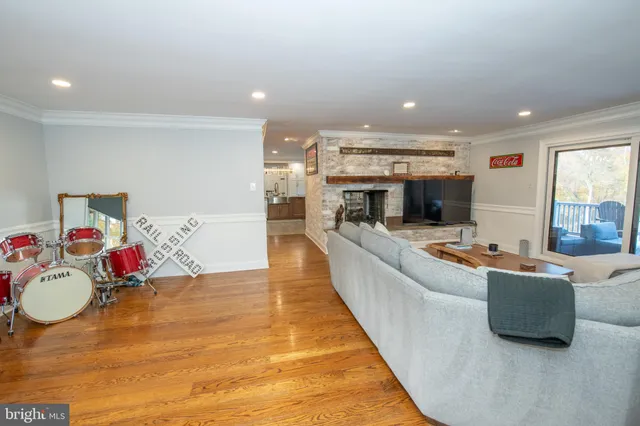 a bedroom with furniture and a flat screen tv