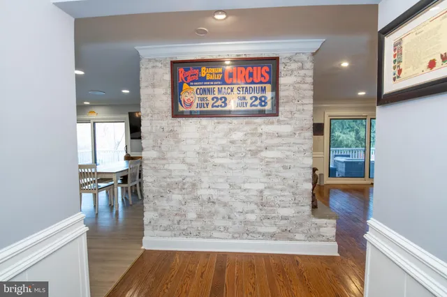 a bedroom with furniture and a flat screen tv