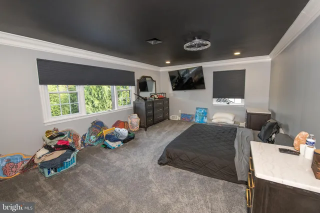 a view of backyard with a patio and wooden fence
