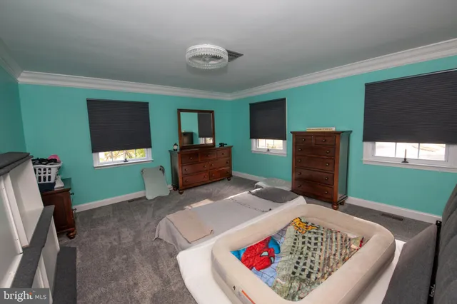 a car parked in front of a brick house