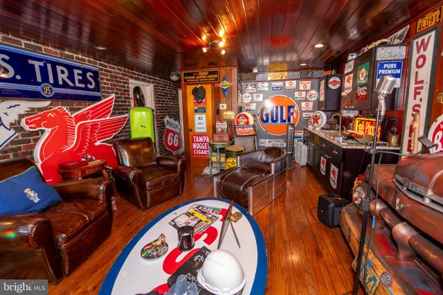 a large kitchen with stainless steel appliances kitchen island granite countertop a sink and cabinets
