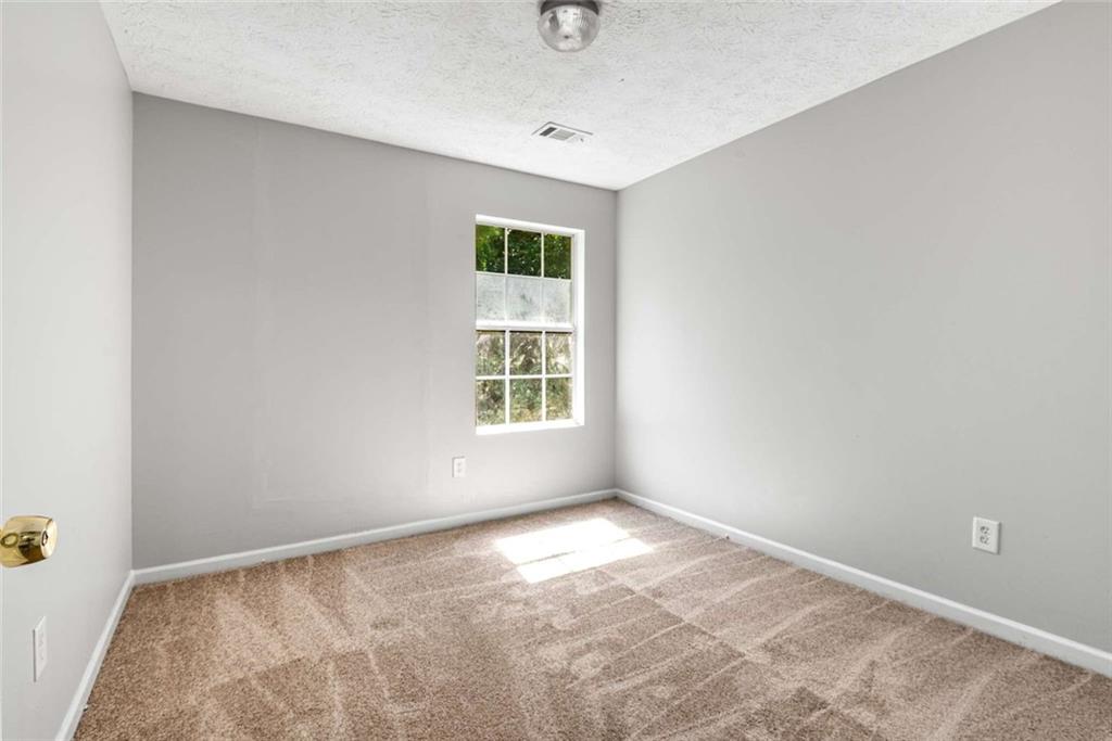 588 Elles Way Griffin, GA 30223 - Photo 20 of 32 an empty room with a window