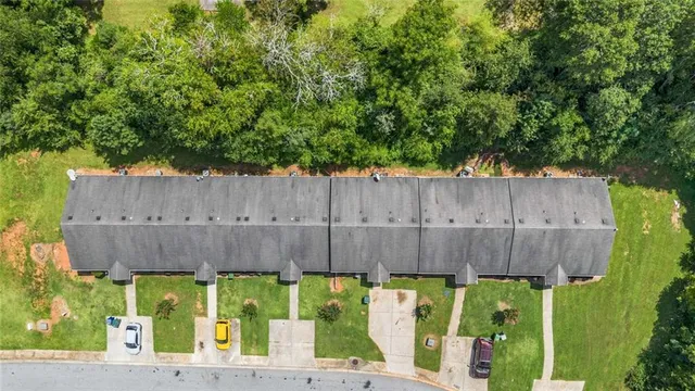 a view of a backyard with wooden fence