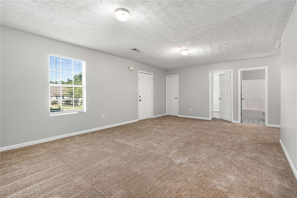 588 Elles Way Griffin, GA 30223 - Photo 5 of 32 a view of an empty room with a window