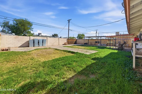 a view of a swimming pool with a yard