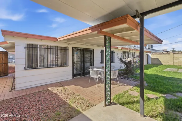 a house view with a play ground in front of it