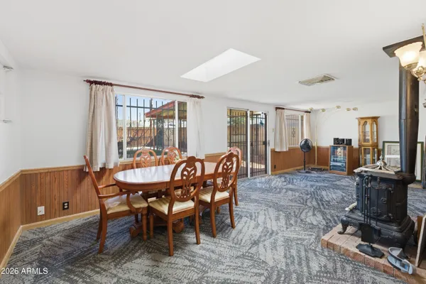 a kitchen with stainless steel appliances a refrigerator and a table