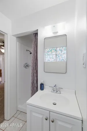 a bathroom with a sink and a mirror