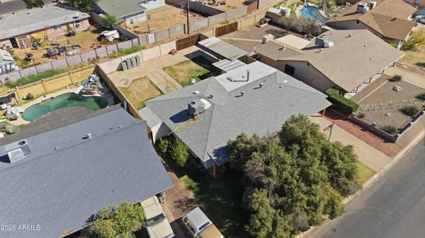an aerial view of residential houses with outdoor space