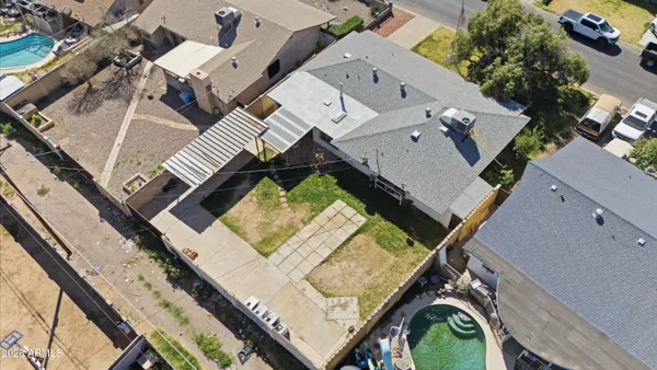 an aerial view of a house with a ocean view