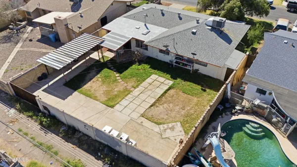 an aerial view of residential houses with outdoor space
